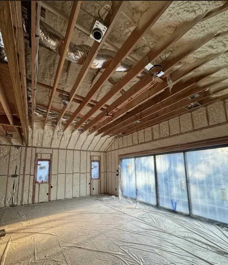 Interior walls and ceiling insulated with spray foam during new construction in Orleans