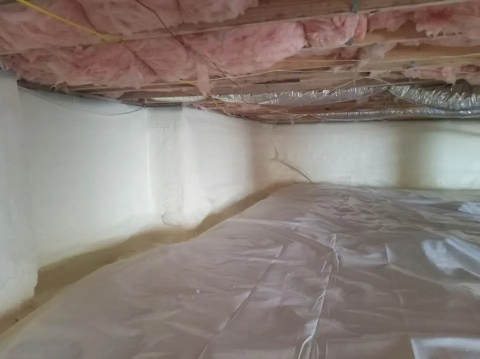 Crawl space encapsulation with closed-cell spray foam for Commercial Roof Restoration in Orleans